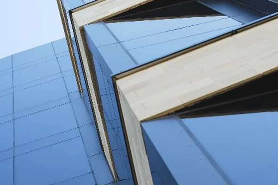 Sun control window film installed on a wall of glass