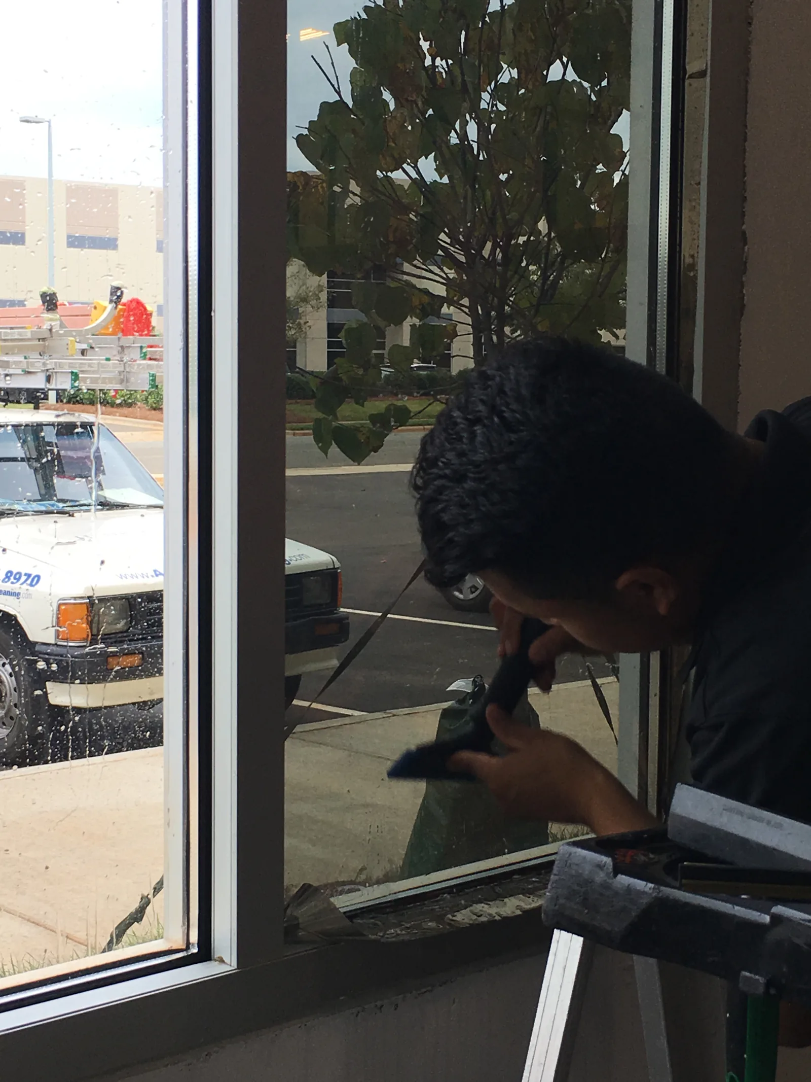 Cleaning film-treated commercial glass in Charlotte
