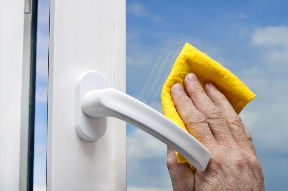 Cleaning a window with a cloth