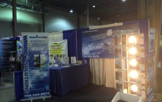 AAA Window Cleaning booth at a convention hall